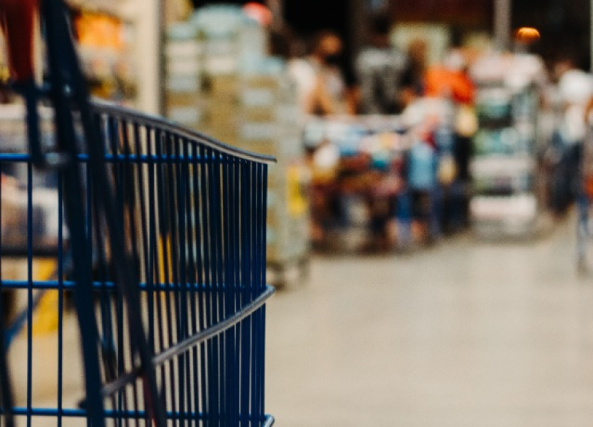 side of a shopping cart in a grocery store