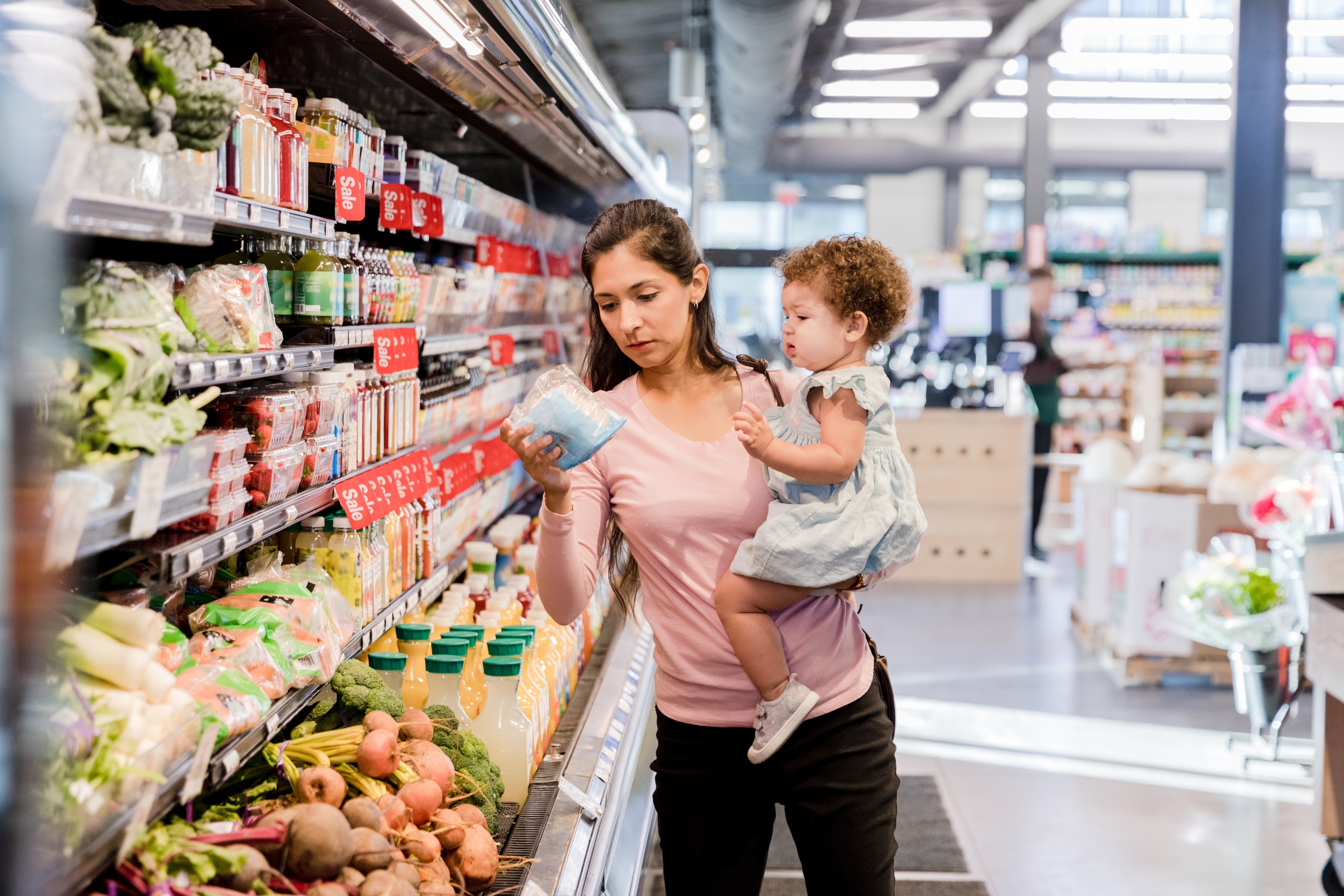 young mother grocery shopping