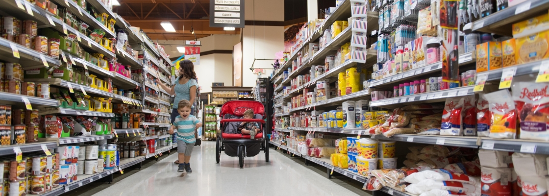 mom at the grocery store with his son with down syndrome