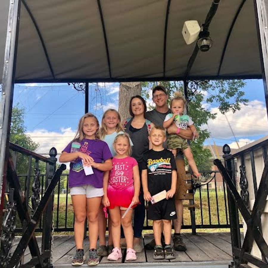 the Mason family poses for a photo outdoors